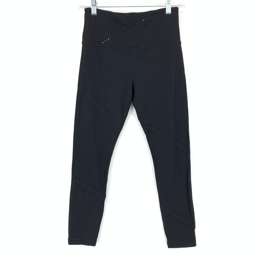 Athleta Its A Wrap 7/8 Tight Leggings Womens Size Small Black Laser Cut Detail